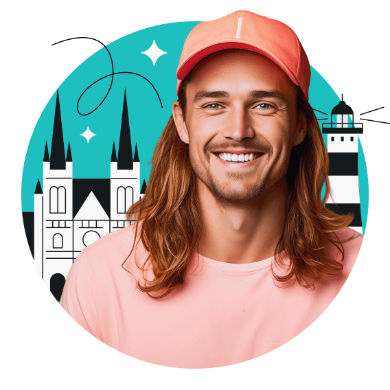 A smiling long-haired man wearing a pink shirt and cap; St. Peter’s Cathedral and a lighthouse in the background.
