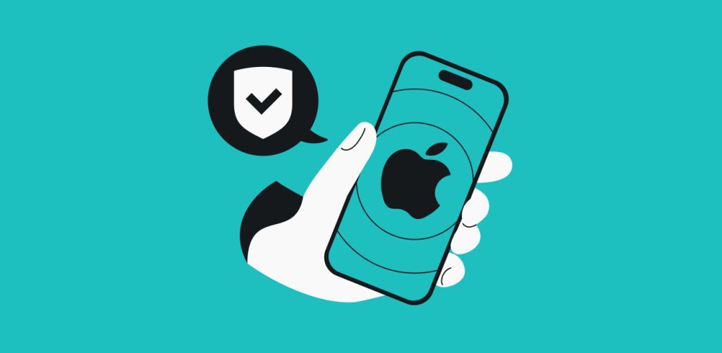 A hand holding a smartphone with Apples logo on the screen and a speech bubble with a shield and checkmark next to the phone.