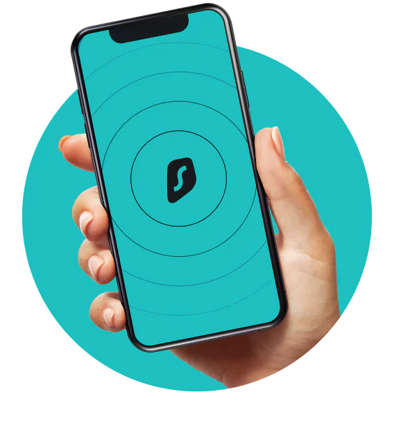 A hand holding a black smartphone displaying a teal background with concentric circles and a Surfshark logo in the center.