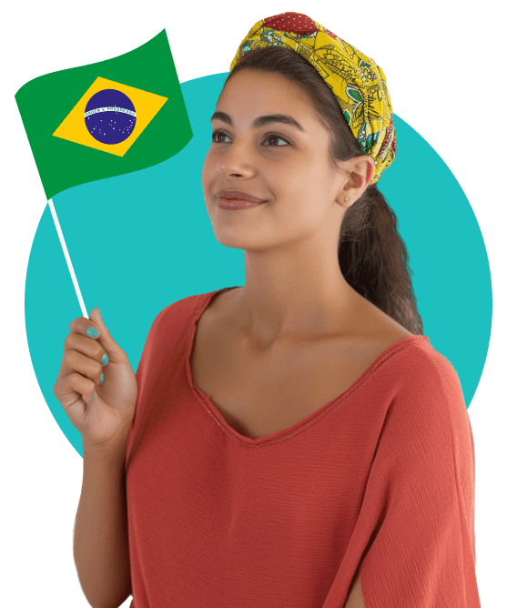 A young woman with dark hair tied back, wearing a yellow patterned headscarf and holding a small Brazilian flag.