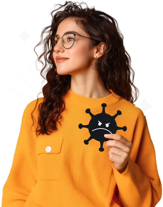 A woman with long, dark, curly hair, glasses, and an orange sweater looking to her right and holding an angry black virus.
