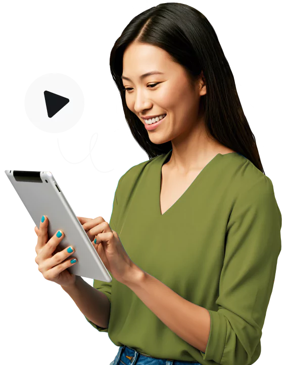 A smiling woman in a green blouse using a tablet with a play icon above it.