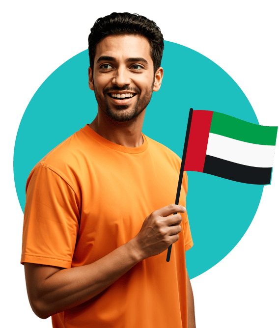 A smiling man in an orange Tshirt holding a United Arab Emirates flag.