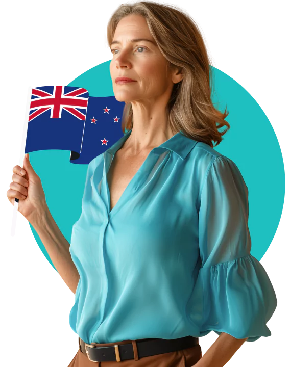 A woman in a light blue blouse holding a New Zealand flag.