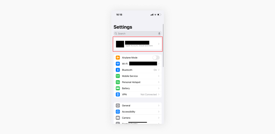 Screenshot of an iPhones Settings menu with the Apple ID section highlighted.
