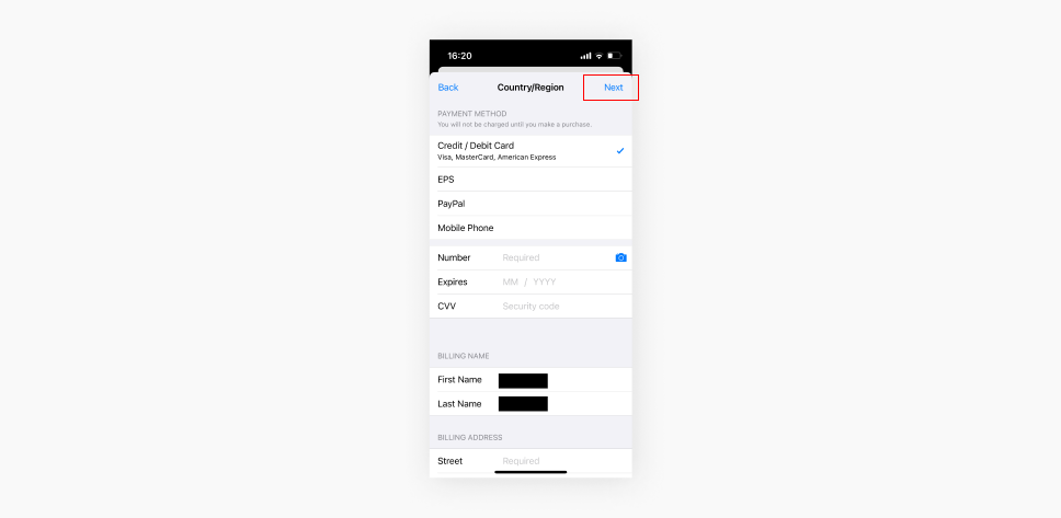 Screenshot of an iPhones Country Region settings popup with payment method details and the Next option highlighted.
