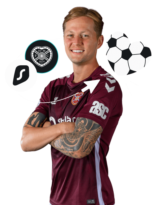 A smiling Frankie Kent in a maroon jersey standing by the Surfshark logo and the Heart of Midlothian Football Club crest.
