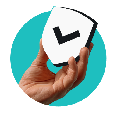 Hand holding a tilted white shield with a black check mark
